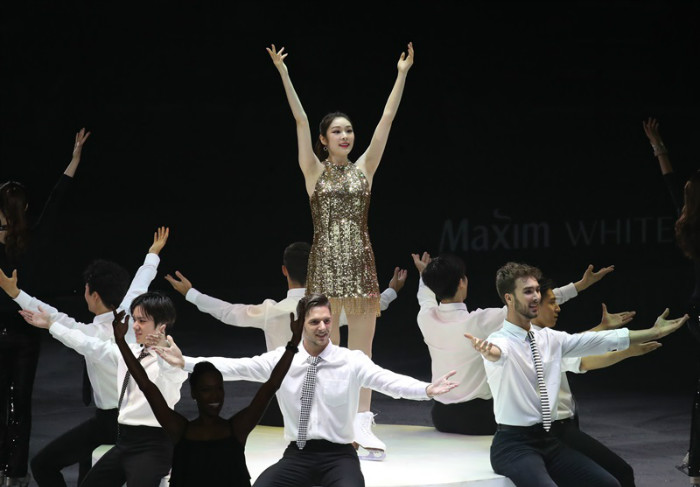 Kim Yuna leads a group dance to the swinging jazz classic "Sing Sing Sing" by Benny Goodman in the ice show